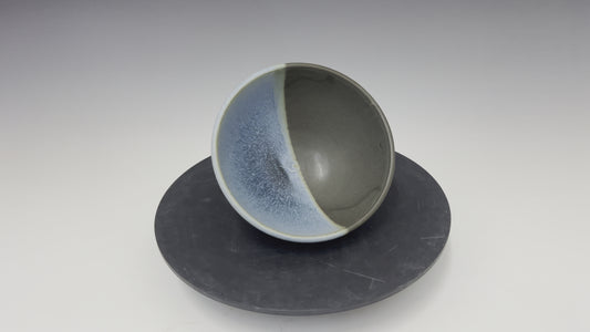 Small black and blue bowl.